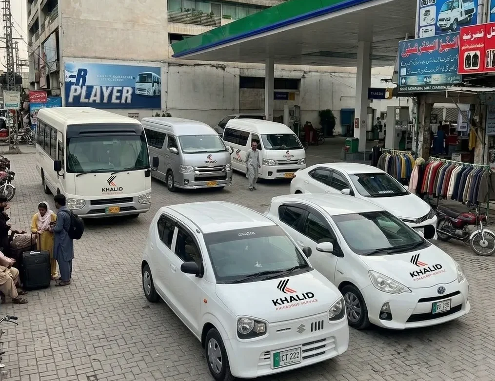 Khalid Pick and Drop Service fleet vehicles, including Suzuki Alto, Toyota Hiace and passenger coaster buses and SUVs in .